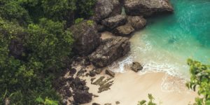 aerial-view-of-seashore-near-large-grey-rocks-853199